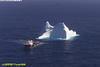 Vessel towing iceberg